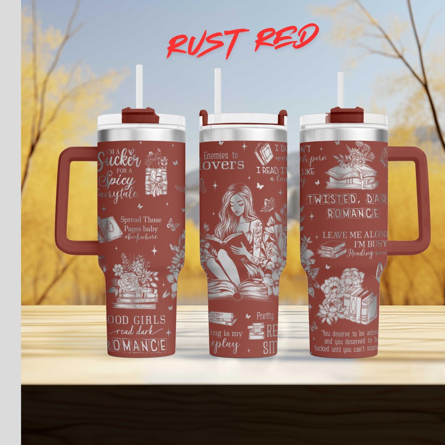 three red tumblers with various texts and illustrations printed on them.
