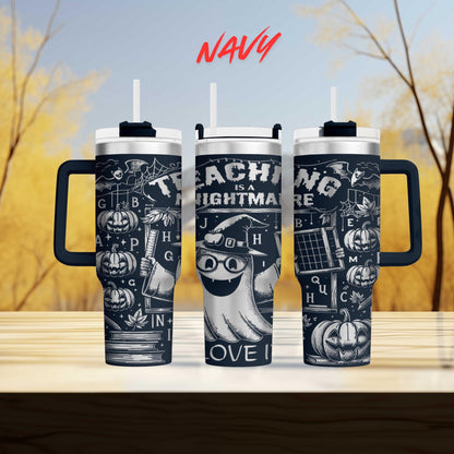 three black and white tumblers with Halloween-themed designs, including a ghost, pumpkins, and other spooky elements.