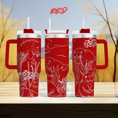 three red tumblers with illustrations of sea animals, including a manatee, on their surfaces.