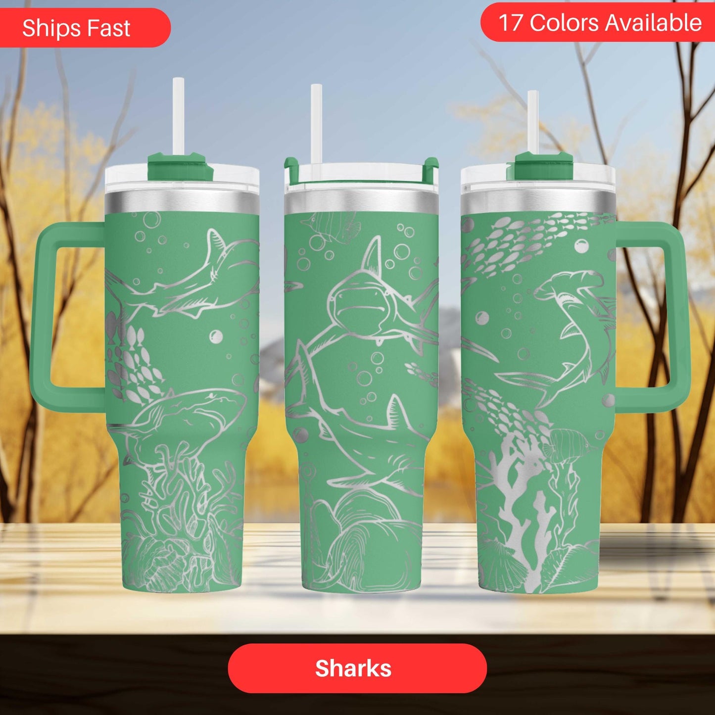three green tumblers with shark designs on them.