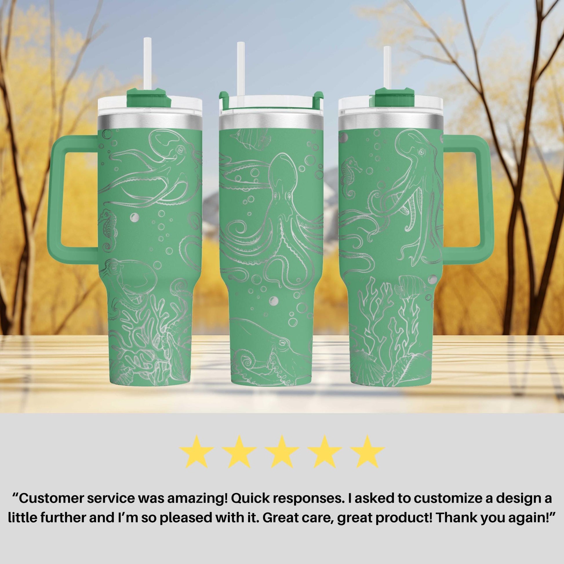 three green tumblers with white designs, including an octopus and bubbles, placed on a wooden surface against a blurred background of trees.