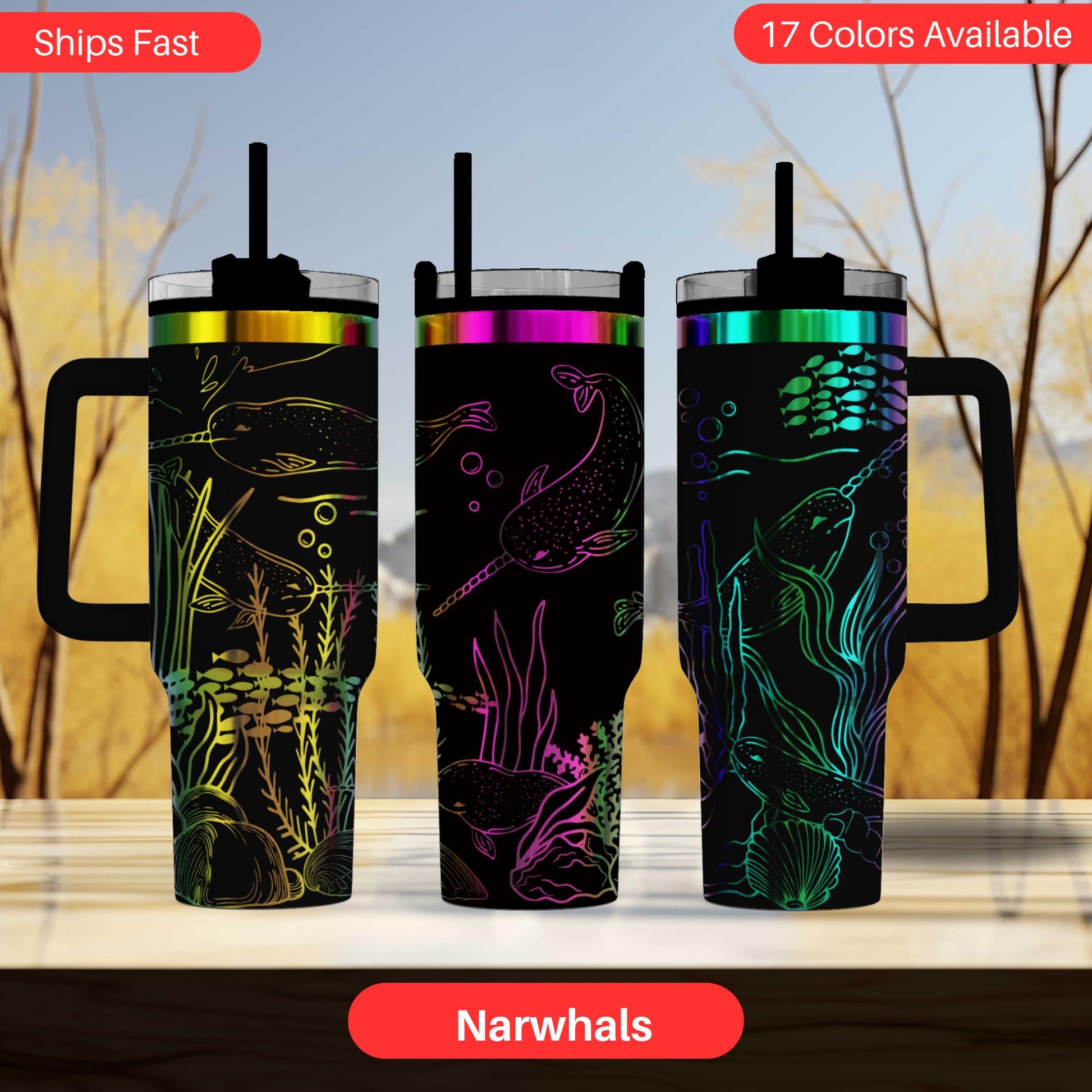 three colorful tumblers with fish designs, including narwhals, on their lids.