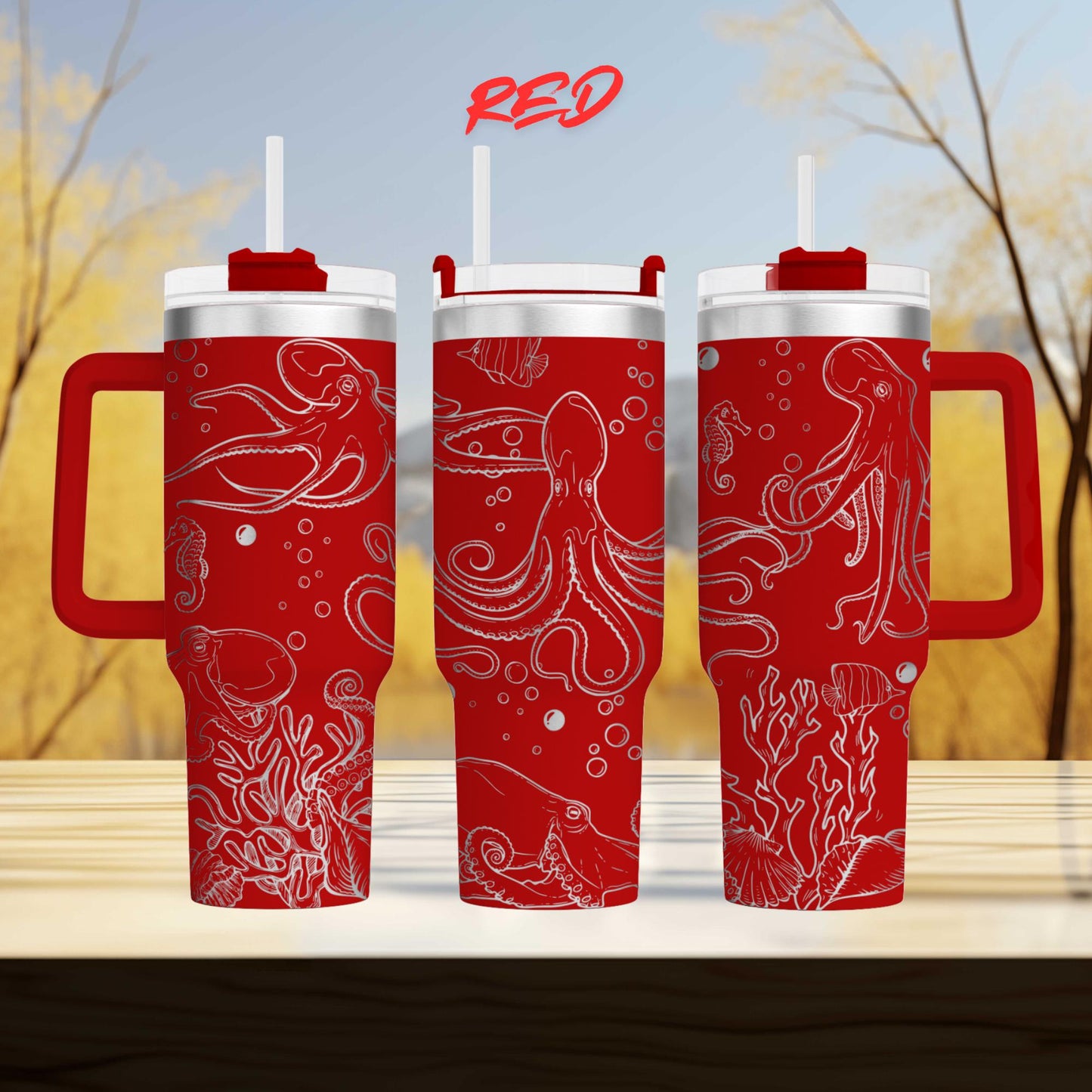 three red tumblers with white designs of marine life, including octopuses and bubbles, printed on them.