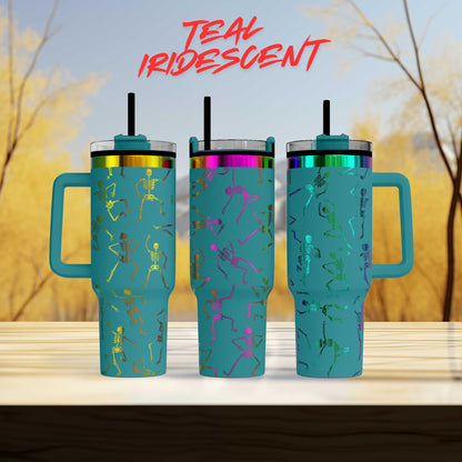 three teal-colored tumblers with a unique design of skeletal figures on them, set against a blurred background of trees.