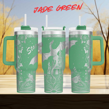A set of three green tumblers with a dragon design on them, set against a blurred background of trees and sky.