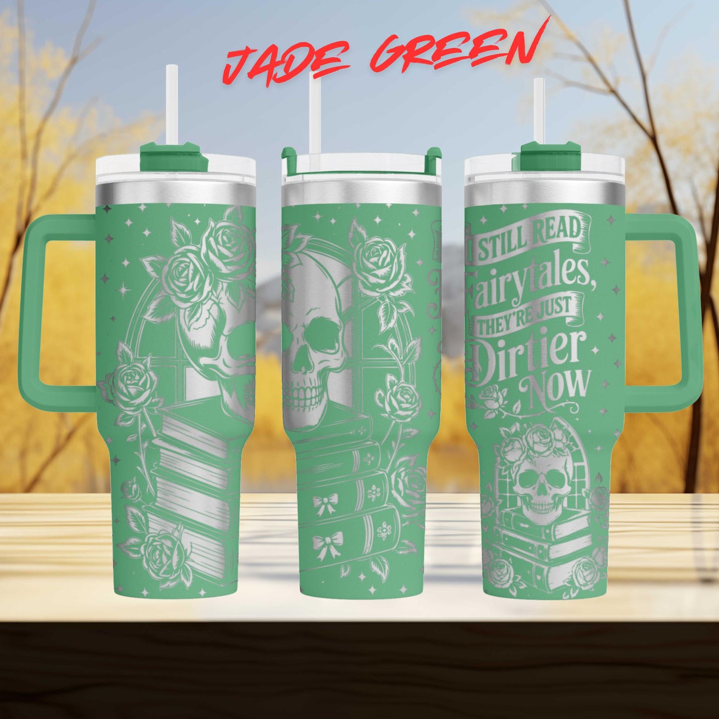 A set of three green tumblers with white text and designs on them. The text on the tumblers reads "JADE GREEN" and "STILL READ AIRRYALES, THEY'RE JUST DIRIER NOW".