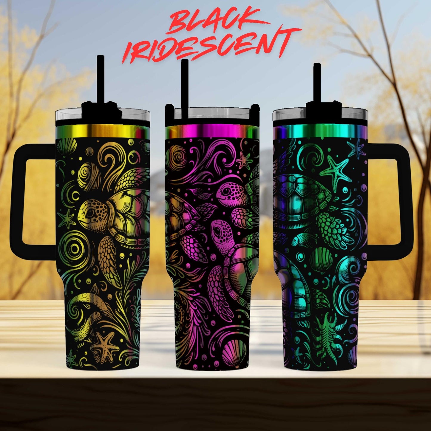 three colorful, patterned tumblers with handles, arranged in a row on a wooden surface.