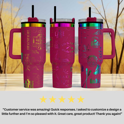 three pink tumblers with various designs and text on them, placed against a blurred background of trees.