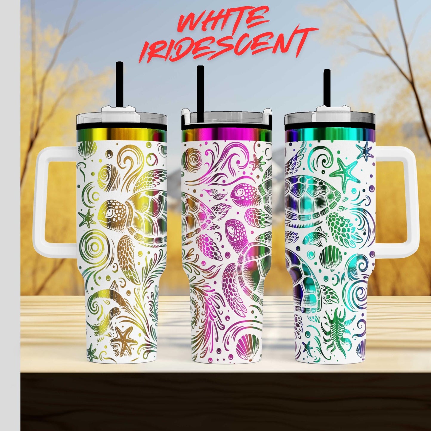 Three colorful, patterned tumblers with handles, arranged in a row against a blurred natural background.