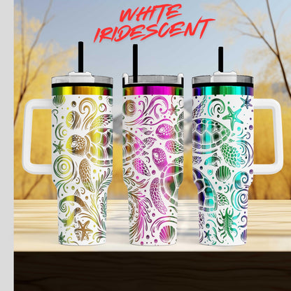 Three colorful, patterned tumblers with handles, arranged in a row against a blurred natural background.