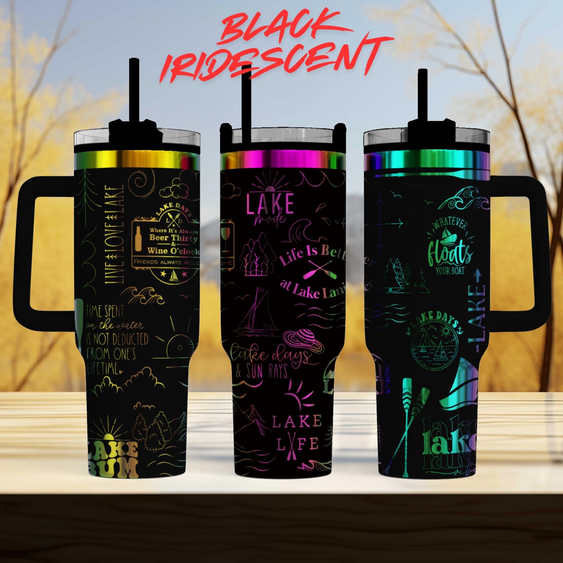 three colorful stainless steel tumblers with various designs and text printed on them.