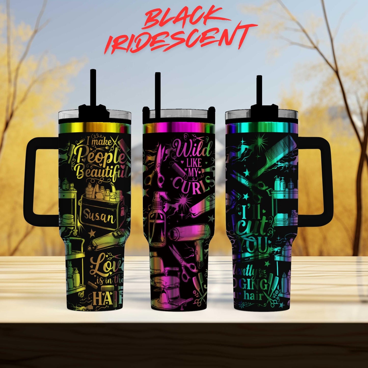 three colorful tumblers with various designs and text on them, set against a blurred background of trees.